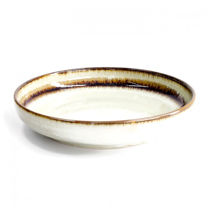 Saladier japonais avec cerisier en motif sur fond bleu foncé.