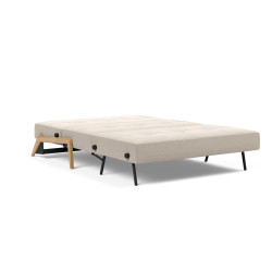 Modulable avec une structure en métal, pieds et accoudoirs en chêne massif.