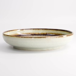 Saladier japonais avec cerisier en motif sur fond bleu foncé.